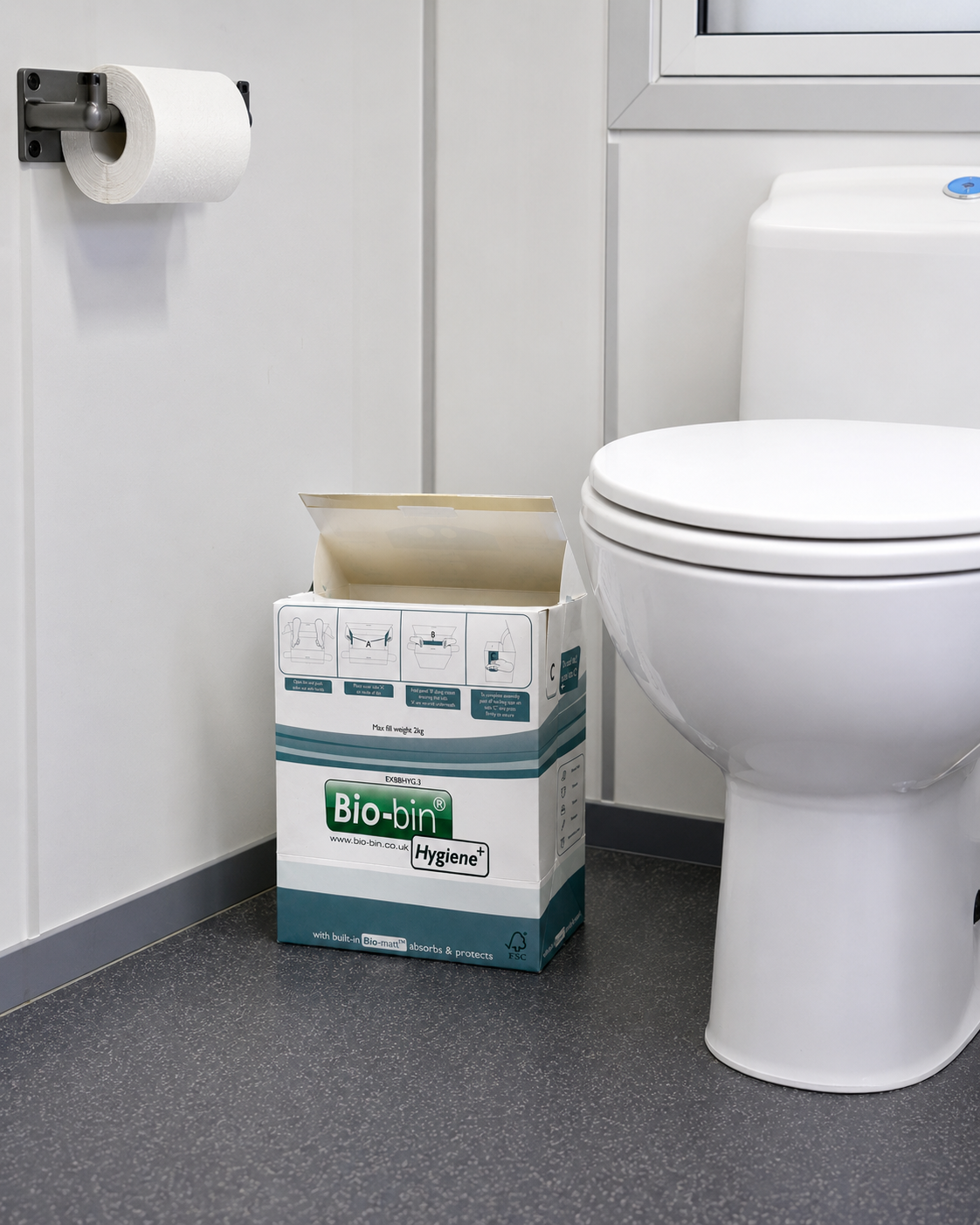 Hygiene+ Bio-bin sanitary waste bin installed next to a washroom toilet